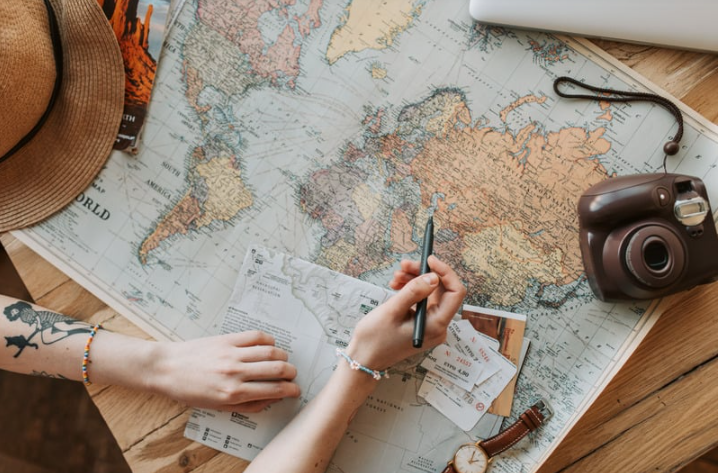 traveler planning by looking at a map